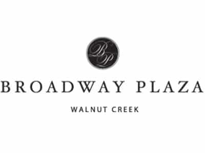 Logo of Broadway Plaza, a shopping center located in Walnut Creek. The design features the text 'BROADWAY PLAZA' in bold letters above 'WALNUT CREEK,' with a circular emblem containing the initials 'BP' above it.